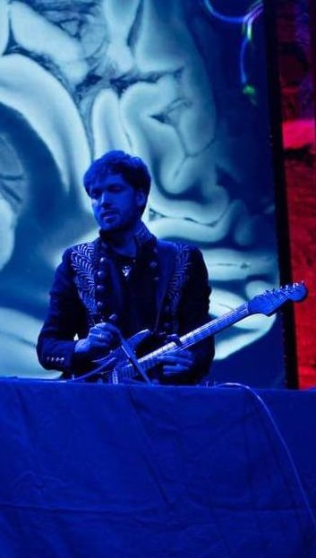 Tyler performing with brain projection