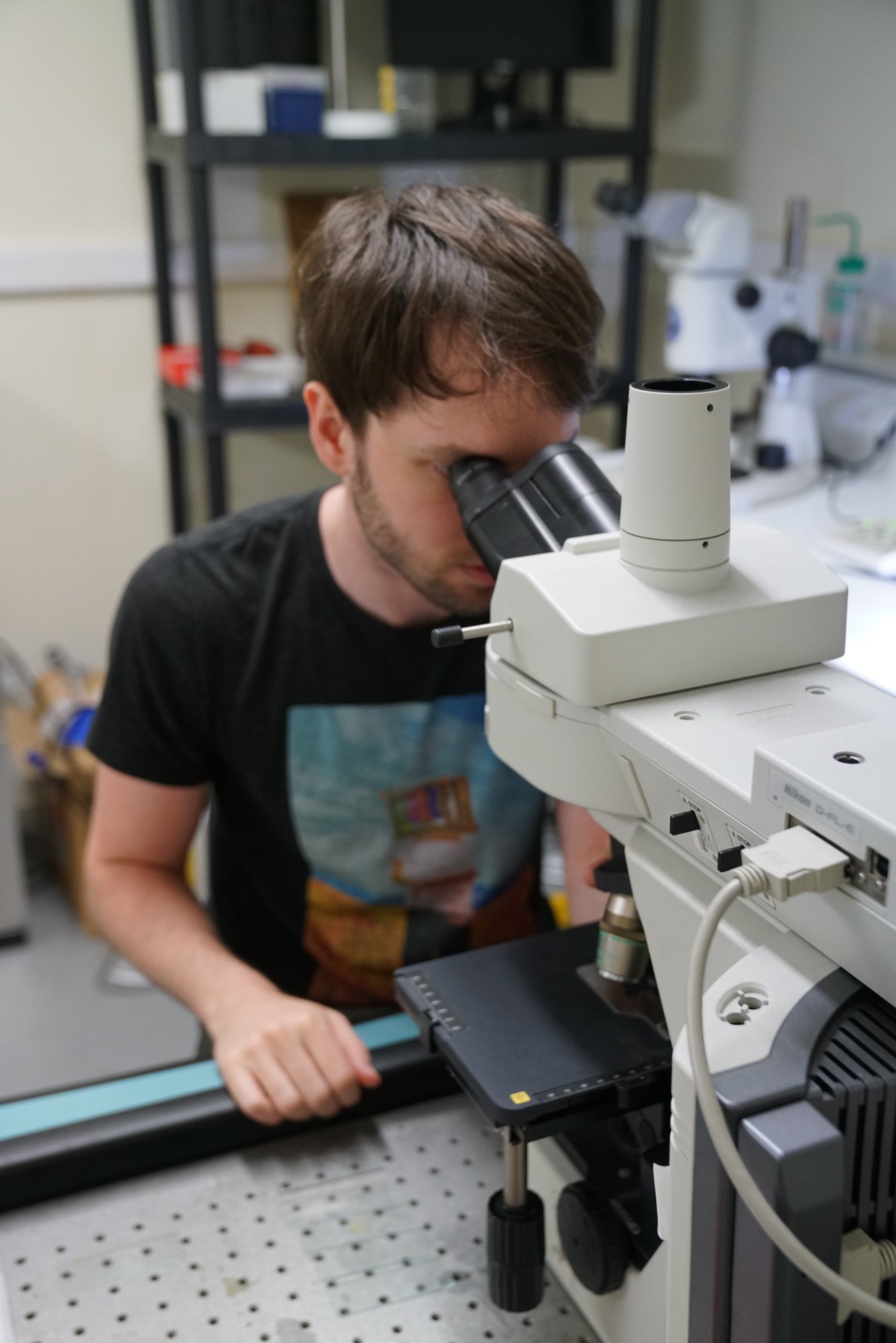 Tyler at the microscope