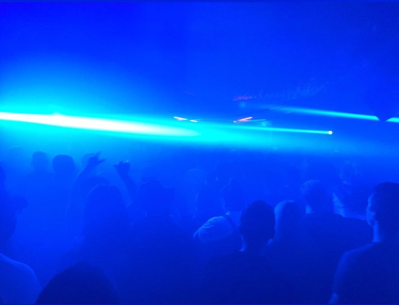 Crowd with blue laser lights