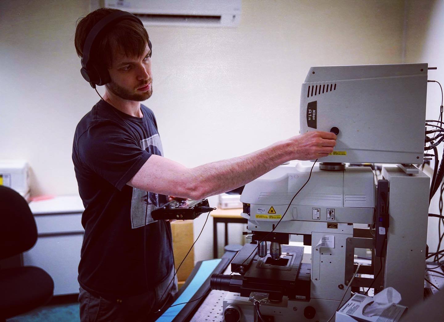 Tyler working with microscope